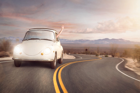 Road trip in a vintage carの写真素材