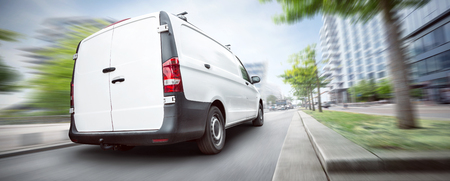 Commercial van driving in the cityの写真素材