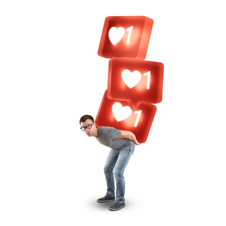 Man carrying a stack of large social media like symbols - isolated on whiteの写真素材