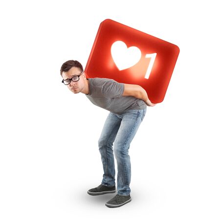 Man carrying a large social media Like Symbol - isolated on whiteの写真素材