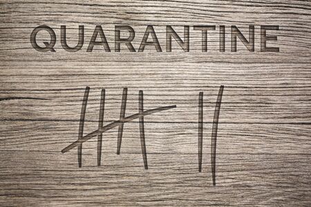 Quarantine Duration Concept - markings on woodの写真素材