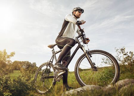 Man with a mountain bike in natureの写真素材