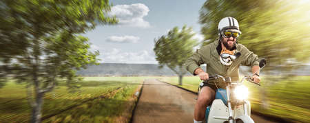 Funny man with his dog riding a motorcycle at top speedの写真素材