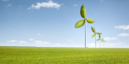 Wind turbines with green leaves as rotorsの写真素材
