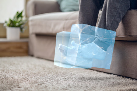 Feet inside ice cubes - cold feet conceptの写真素材