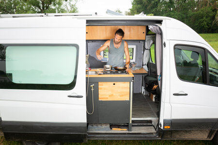 Man living in a DIY camper vanの写真素材
