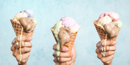 Three melting ice cream cones