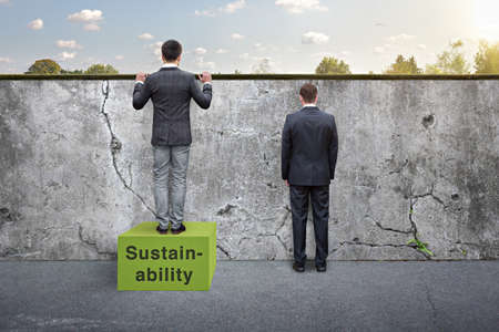Clever man building on sustainability - awareness metaphor