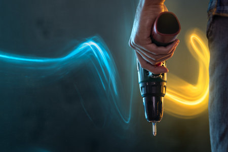 Hand holding an electric screwdriver