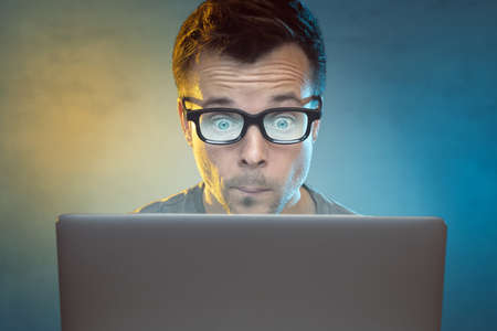 Man in front of a laptop computerの写真素材