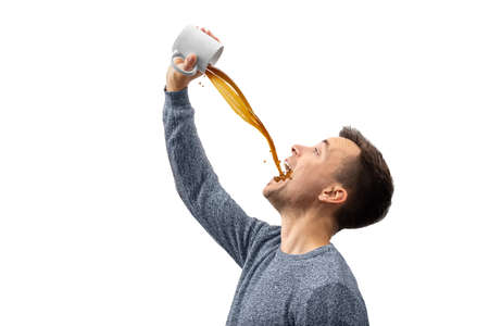 Man drinking a lot of coffee - isolated on whiteの写真素材