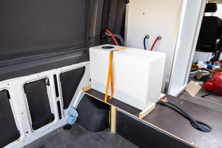 Water tank installed in a camper vanの写真素材