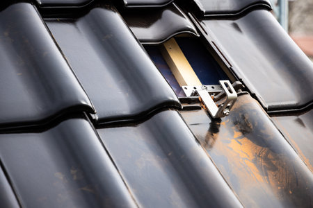 Mounting bracket for solar panels on a tile roofの写真素材