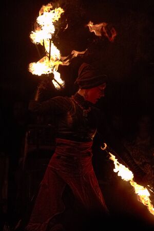 BUCHAREST, ROMANIA - SEPTEMBER 13: Lara Castiglioni performs fire dance with burning torches during B-FIT in the Street, International Street Theater Festival on September 13, 2012 in Bucharest, Romania.のeditorial素材