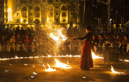 BUCHAREST, ROMANIA - SEPTEMBER 13: Lara Castiglioni performs Neige de Feu show during B-FIT in the Street, International Street Theater Festival on September 13, 2012 in Bucharest, Romania.のeditorial素材