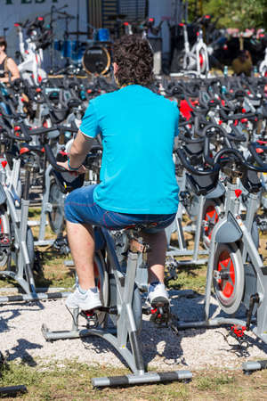 Unidentified young man doing cardio training during a public cycling event on 15 09 2013 in Bucharest, Romania のeditorial素材