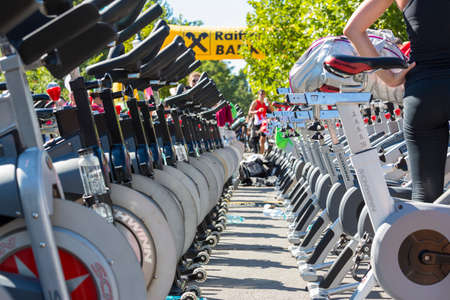 BUCHAREST, ROMANIA - SEPTEMBER 15: Rows of over 200 aligned stationary spinning bikes during a public cycling event on September 15, 2013 in Bucharest, Romania. Low angle detail view between rows.のeditorial素材