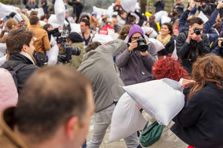 BUCHAREST, ROMANIA - APRIL 5: Large group of unidentified people gather and have fun at annual International Pillow Fight Day on April 5, 2014 in University Square, Bucharest, Romania.のeditorial素材