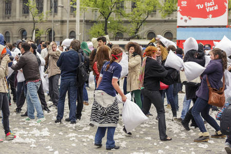 BUCHAREST, ROMANIA - APRIL 5: Large group of unidentified people gather and have fun at annual International Pillow Fight Day on April 5, 2014 in University Square, Bucharest, Romania.のeditorial素材