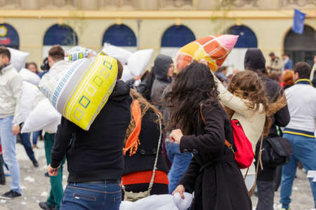 BUCHAREST, ROMANIA - APRIL 5: Large group of unidentified people gather and have fun at annual International Pillow Fight Day on April 5, 2014 in University Square, Bucharest, Romania.のeditorial素材