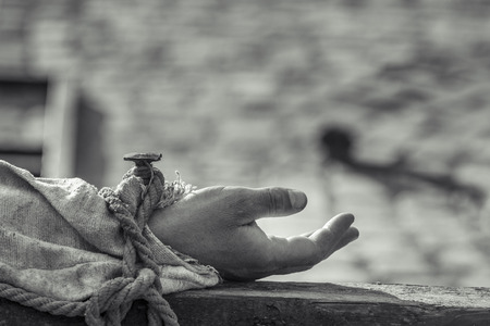 Nailed hand on wooden cross  Crucifixion of Jesus Chris  Black and white の写真素材