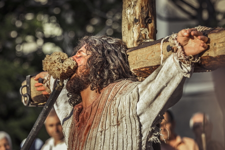 BUCHAREST, ROMANIA - MAY 3: Unidentified man plays Jesus Christ suffering on the cross during the...