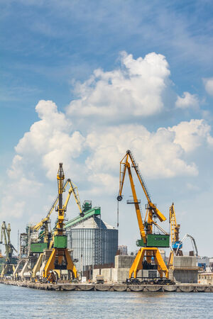 CONSTANTA, ROMANIA - MAY 27, 2014: Industrial port quay with heavy load gantry cranes in Constanta port, the largest on the Black Sea and the 18th largest in Europe.のeditorial素材