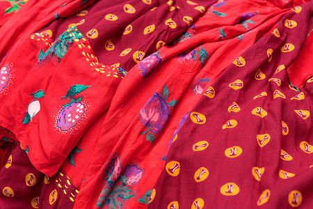 Detail of colorful traditional gipsy dresses fabrics with floral patterns. Shallow depth of field.の写真素材
