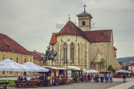 ALBA IULIA, ROMANIA - MAY 6, 2015: Unidentified tourists visit the Saint Michael Roman Catholic cathedral, the oldest and the longest cathedral in Romania (89.16 m along its axis).のeditorial素材