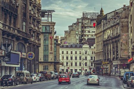 Bucharest, Romania - March 16, 2014: Picturesque cityscape with Victory Avenue (Calea Victoriei), a major avenue in central Bucharest, lined with fashion shops, art boutiques, hotels and restaurants.のeditorial素材
