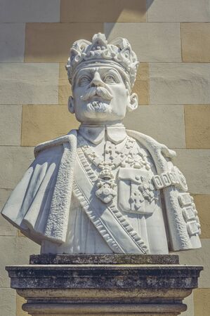 Alba Iulia, Romania - July 24, 2016: Imposing marble bust sculpture of King Ferdinand I of Romania placed in front of the Coronation Orthodox Cathedral in the Alba Iulia Fortress.のeditorial素材