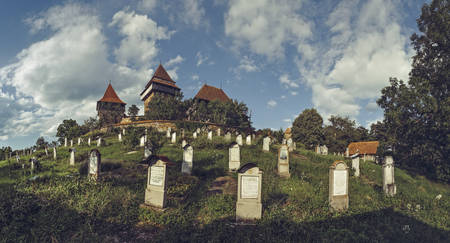Viscri, Romania - July 21, 2016: Viscri fortified church and its graveyard, listed in 1999 , Villages with Fortified Churches in Transylvania.のeditorial素材