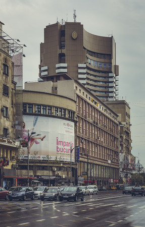 Bucharest, Romania - April 22, 2014: Urban view with busy Magheru Boulevard on a rainy day, a major avenue in central Bucharest and one of Europe and world's most representative modernist boulevards.のeditorial素材