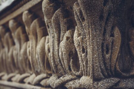 Architectural closeup of classic bas-relief carved ornaments of the public central fountain in Union Square (Piata Unirii), Bucharest, Romania. Shallow depth of field, selective focus.の写真素材