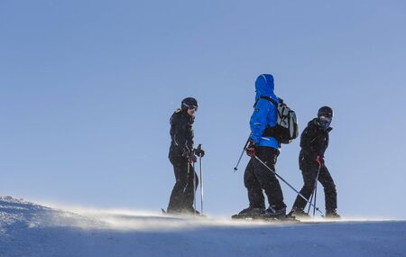 Poiana Brasov, Romania - January 1, 2017: Skiers enjoy a sunny day on the ski slopes in Postavaru Mountain, Poiana Brasov, the most appreciated Romanian winter resort.のeditorial素材