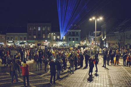 Brasov, Romania - February 4, 2017: Tens of thousands of people peacefully protest in the Council Square against the controversial emergency ordinance on amnesty and pardon law.のeditorial素材