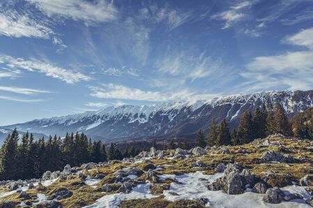 Idyllic alpine winter landscape with Zanoaga meadow, Piatra Craiului mountains, Romania.