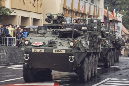 Brasov, Romania - May 14, 2015: American convoy of troops and heavy armored vehicles march through Brasov city on their way to Cincu to take part in an international drill.のeditorial素材