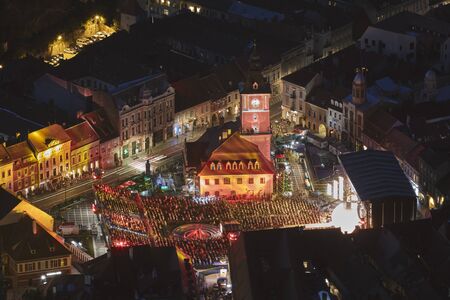 Brasov, Romania - September 1, 2018: Twilight aerial view of the Golden Stag (Cerbul de Aur)...