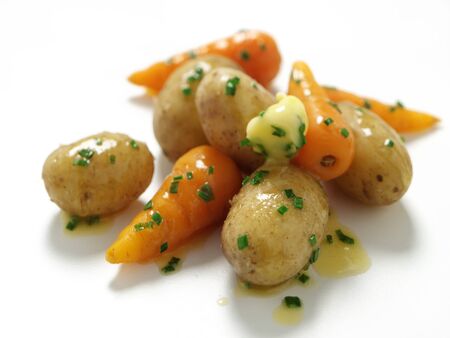 Baby potatoes and baby carrotsの写真素材