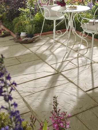 Garden patio with white pistro table and chairsの写真素材