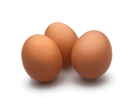 Three eggs on a isolated white background and drop shadowの写真素材