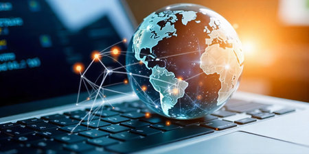 Digital Globe Emerging from Laptopの素材