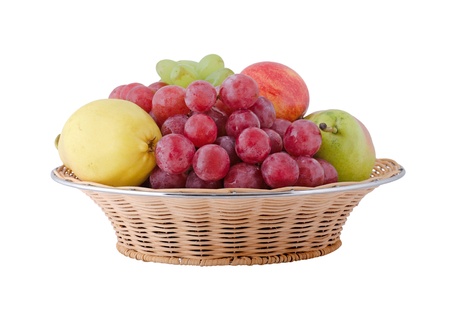 Assorted fruits on a saucer isolated on whiteの写真素材