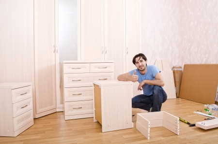 smiling carpenters of furniture thumbs upの写真素材