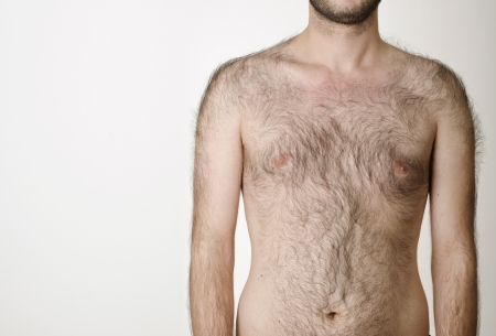 hairy male torso on a white backgroundの写真素材