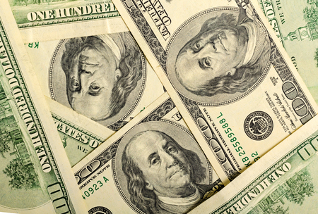 Lots of dollar notes arranged in chaotic manner