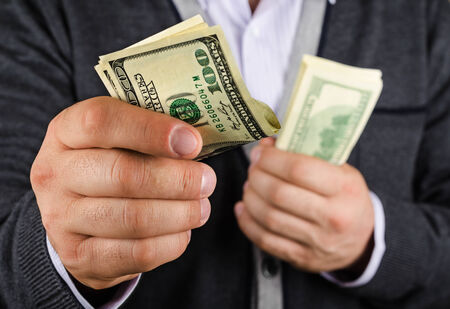 man gives some of the money, closeup