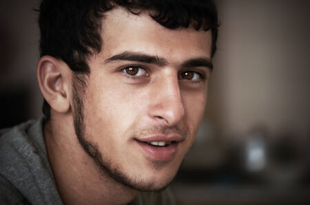 close-up portrait of a young a swarthy guy