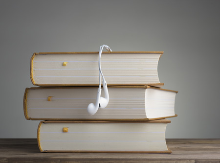 Book with headphones on the table. concept of educationの写真素材